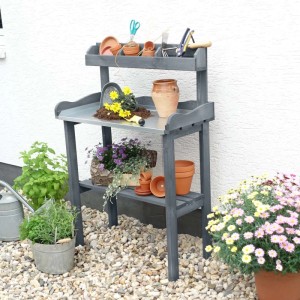 Grauer Promadino Pflanztisch mit verzinkter Arbeitsfläche und Ablage für Gartenzubehör.