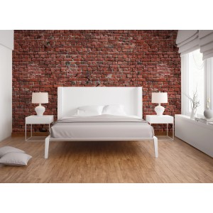 Fototapete Steinwand Klinker rot-braun im Industrial Vintage Stil hinter einem Bett.