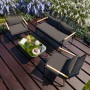 4-teiliges GARMIO Polyrattan Gartenmöbel Set mit Sitzbank, Stühlen und Glastisch.