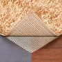OBI Teppichunterlage 80x130 cm unter Teppich auf Holzboden und Steinboden.