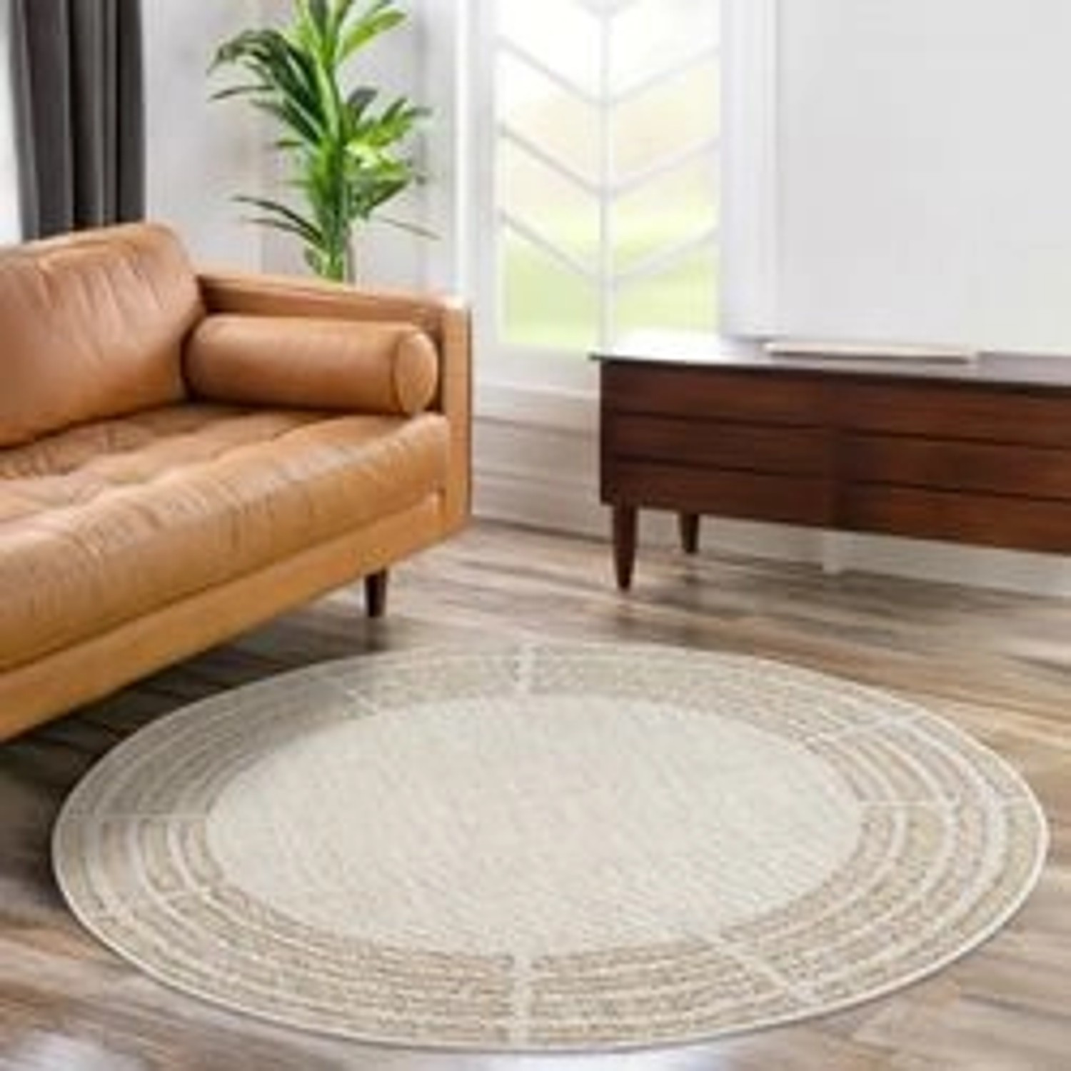 Runder payé Teppich Klassiko 68 mit Fransen, 160x160 cm, im Wohnzimmer.