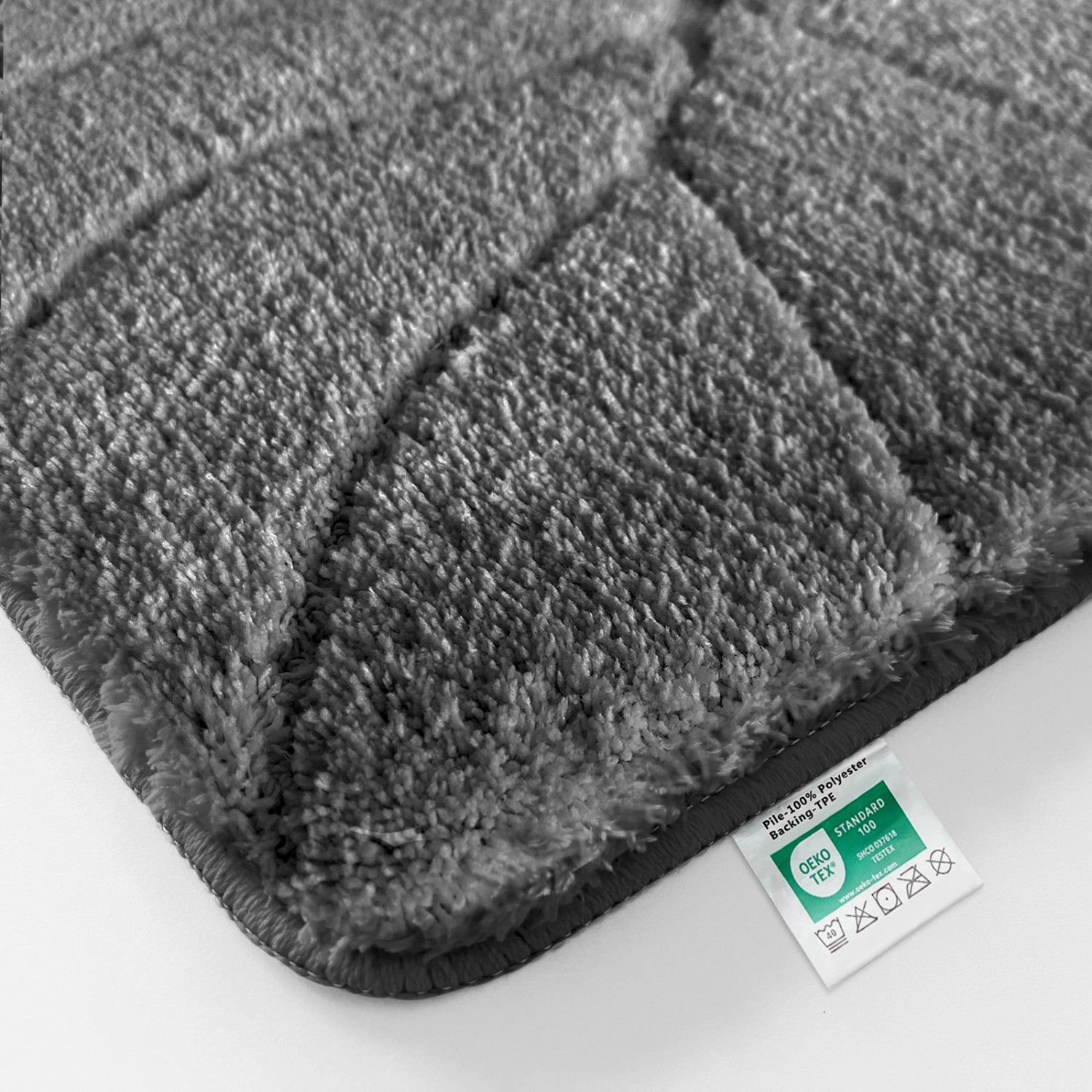 Dunkelgraue Karat Badematte Maris (80x150 cm) mit Blattstruktur. Badvorleger/Badteppich aus Polyester.