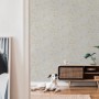 A.S. Création Vliestapete Blumen Beige-Weiß im Wohnraum mit Hund und Kommode.