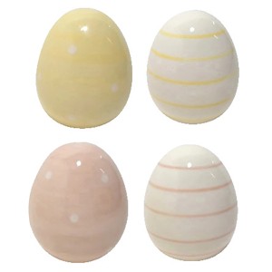 Boltze Deko-Aufsteller Finn, 4er Set Ostereier in Pastellfarben mit Punkten und Streifen.
