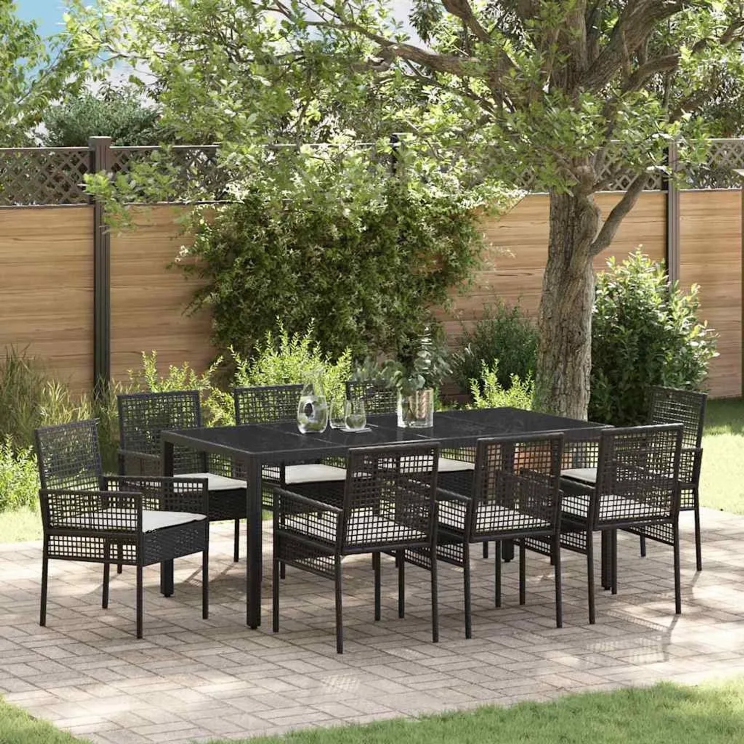 Schwarze 9-teilige vidaXL Garten Essgruppe aus Poly Rattan mit Tisch und 8 Stühlen.
