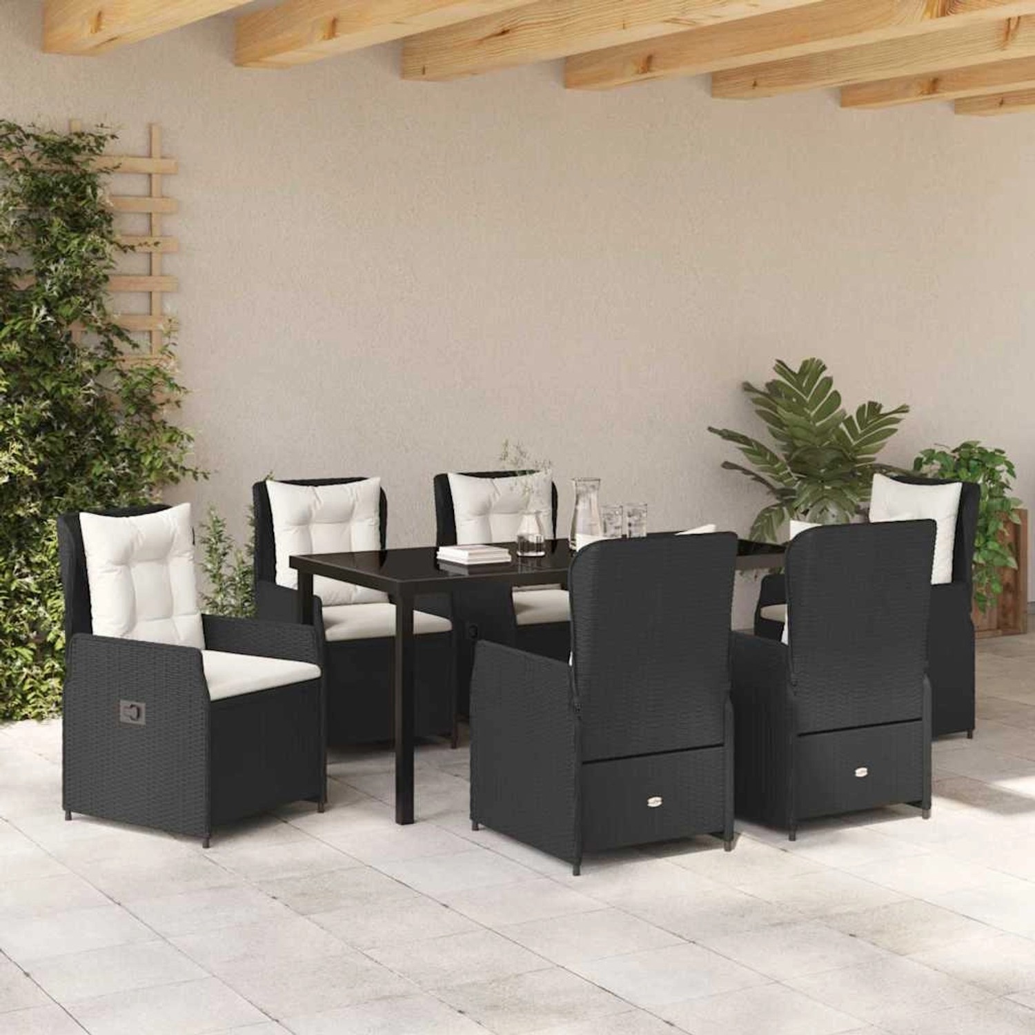 Schwarze 7-tlg. vidaXL Garten Essgruppe aus Poly Rattan mit Tisch und Stühlen mit Auflagen.