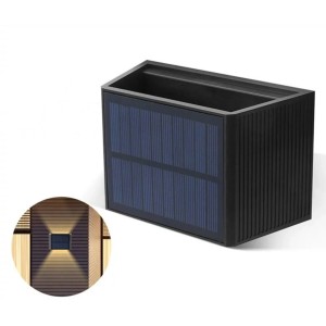 Schwarze LED's Work Solar-Außenleuchte mit Solarpanel und Lichteffekt an einer Wand.