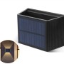 Schwarze LED's Work Solar-Außenleuchte mit Solarpanel und Lichteffekt an einer Wand.