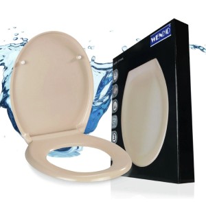 Beiger WENKO WC-Sitz Ottana aus Duroplast mit Absenkautomatik, oval, neben schwarzer Verpackung.