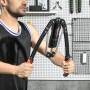 SPORTNOW Power Twister in Schwarz-Rot, von Mann genutzt. Hydraulisches Fitnessgerät für Arm-, Brust- und Rückentraining.