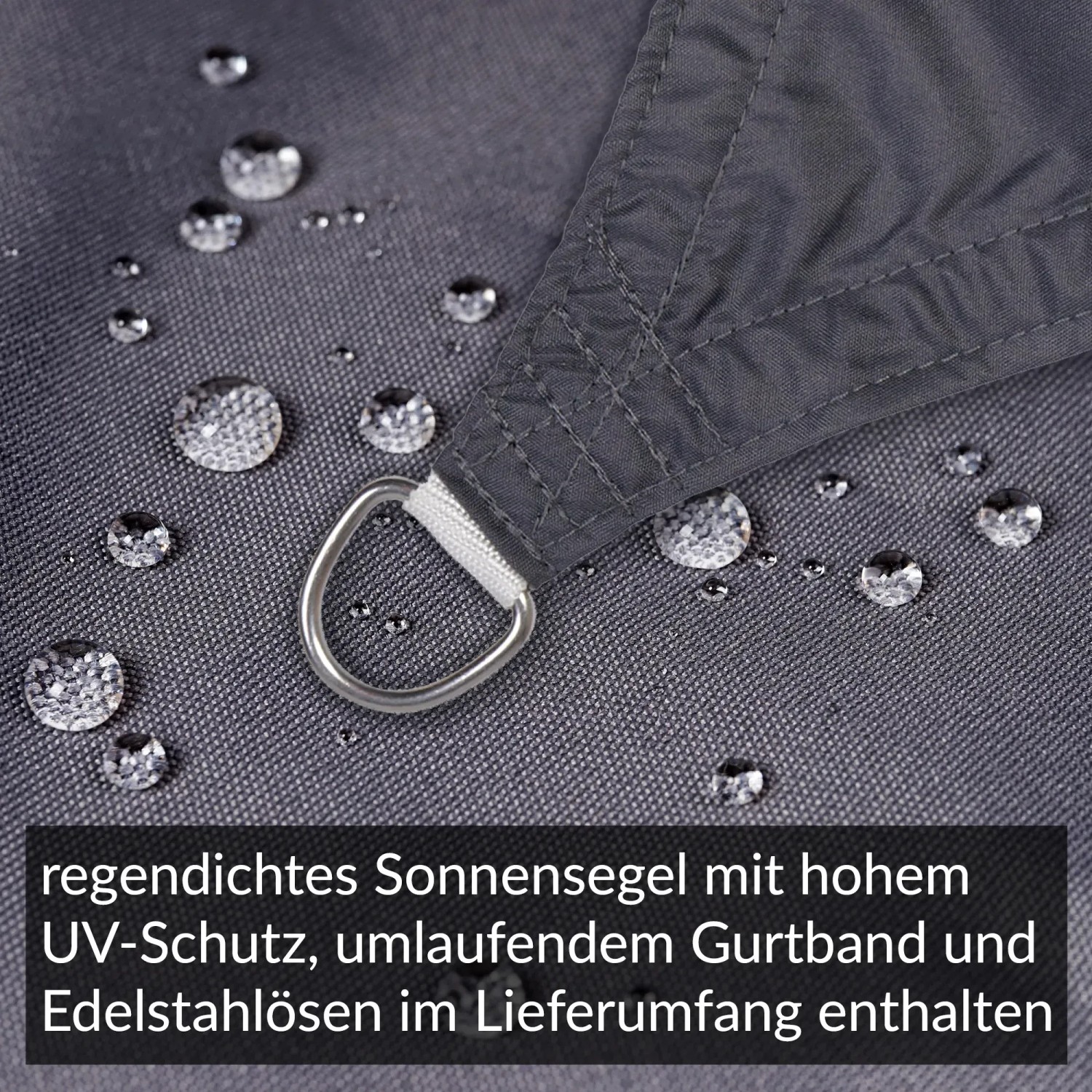 Detailaufnahme: Anthrazitfarbenes Sonnensegel, regendicht, mit Edelstahl-Öse und Wassertropfen.