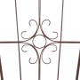 Detailansicht: Bronze-farbenes Eisen Spalier mit filigranem Muster für Kletterpflanzen.