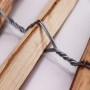 Detailaufnahme: Haselnuss Staketenzaun mit verzinktem Draht, Lattenabstand 4-6cm.