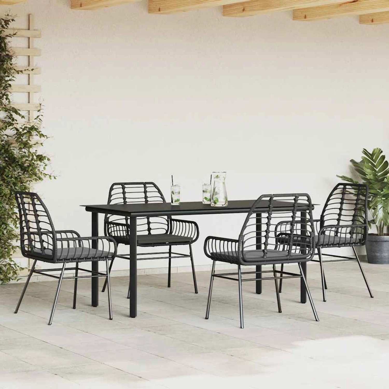 Schwarze 5-tlg. Garten-Essgruppe aus Polyrattan mit Glasplatte und Kissen.