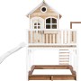 Axi Liam Spielhaus mit Schaukel und Rutsche, braun-weiß, aus Holz mit Sandkasten.