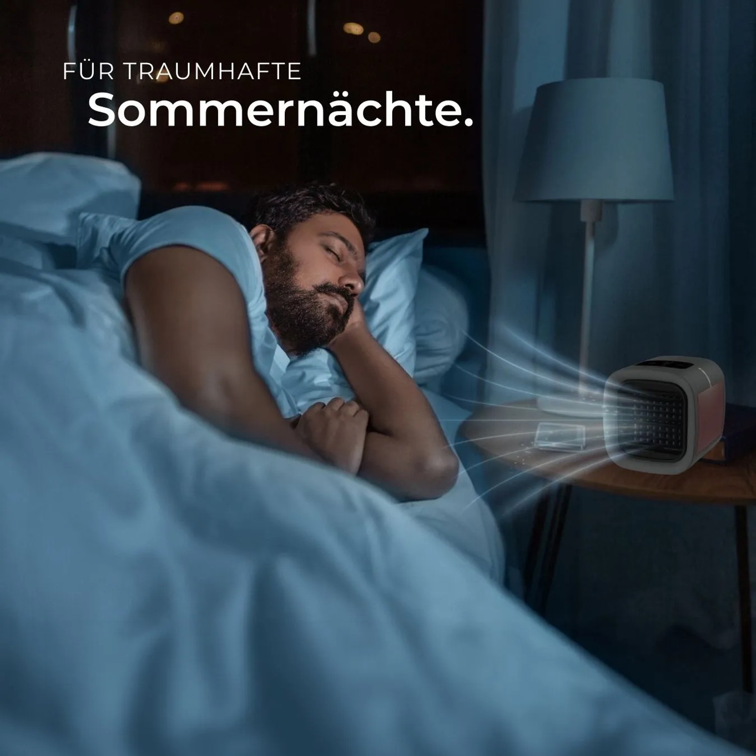 Tectake 3in1 Luftkühler Frosty neben schlafendem Mann im Bett. Klimagerät mit LED-Beleuchtung.