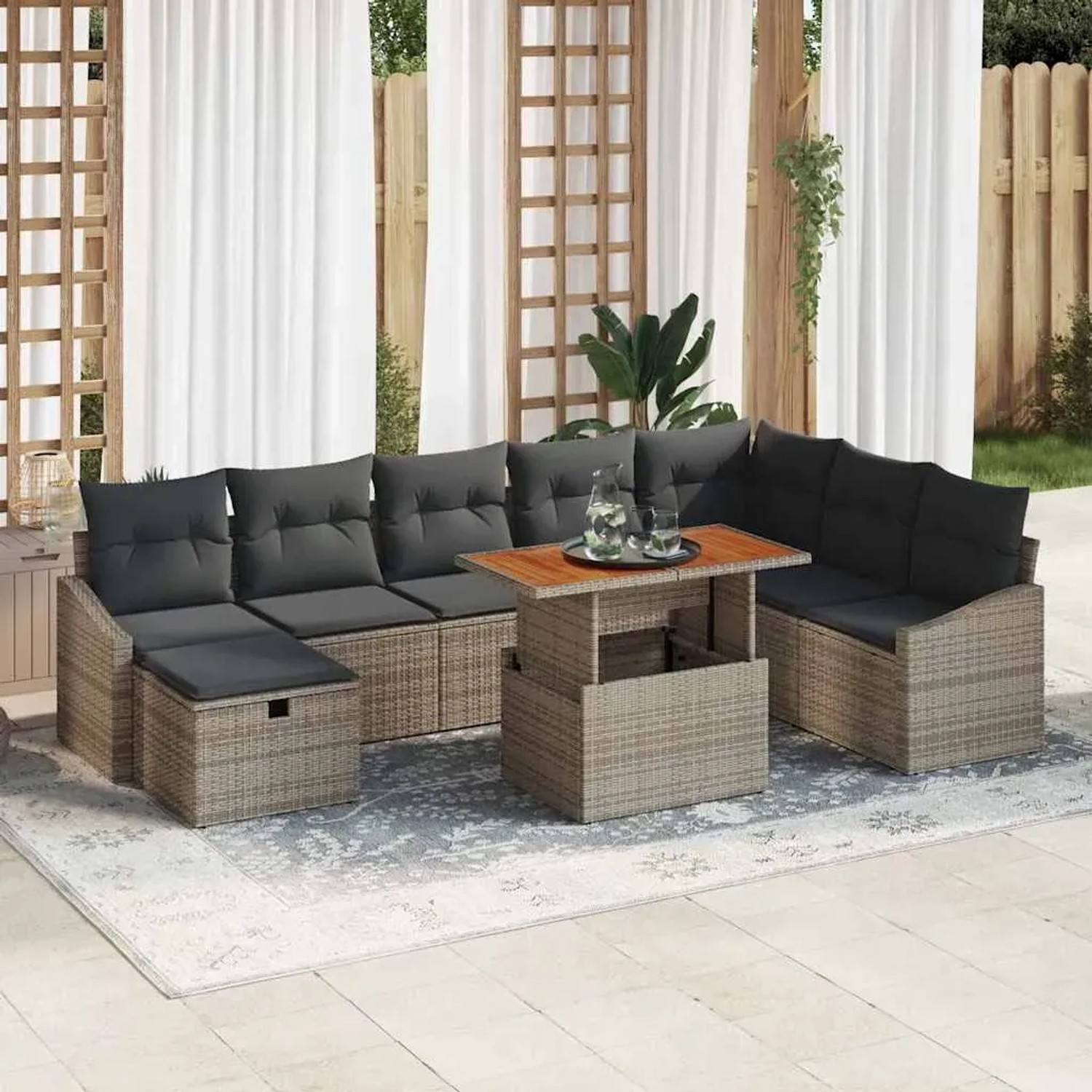 Graues 9-teiliges Garten-Sofa-Set aus Poly Rattan mit Kissen und Stauraum.