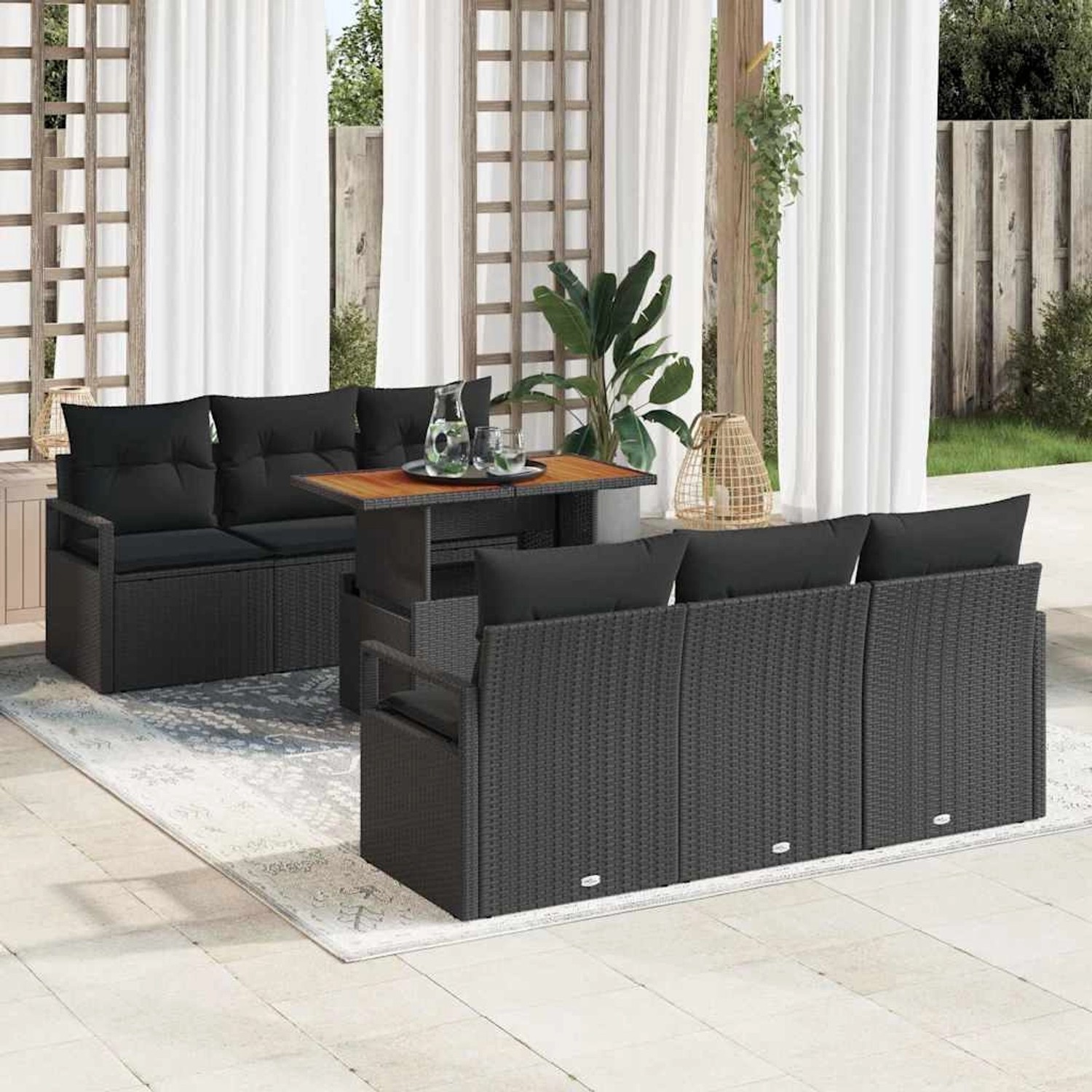 Schwarzes 7-teiliges vidaXL Garten-Sofa-Set aus Poly Rattan mit Stauraum.