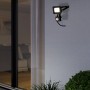 Schwarzer Eglo LED-Wandstrahler Risacca-E mit Sensor an einer Hauswand.