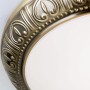 Detailaufnahme: Runde Orion Deckenleuchte Pankok in Antik-Optik mit filigranem Muster.