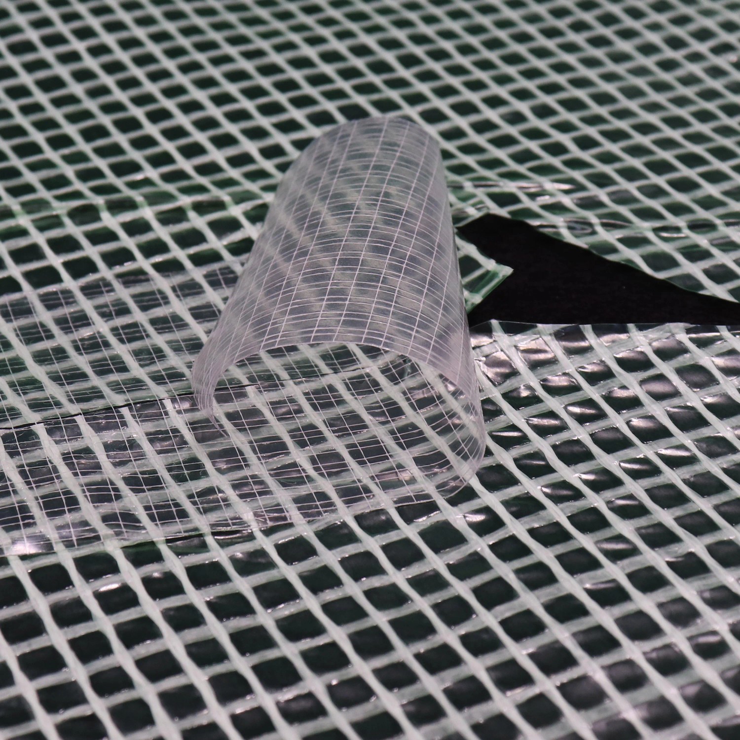 Aquagart Reparaturklebeband für Gewächshausfolie, transparent, auf Gitterfolie. UV-beständig.
