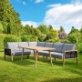Beige Greemotion Gartenlounge Monaco, 4-teilig mit Sofa, Tisch und Eckelement auf Rasen.