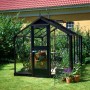 Juliana Gewächshaus Compact 6, anthrazitfarben, mit Pflanzen im Garten.