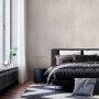 Beige Wandverkleidung in Holznachbildung von Grosfillex im Schlafzimmer.