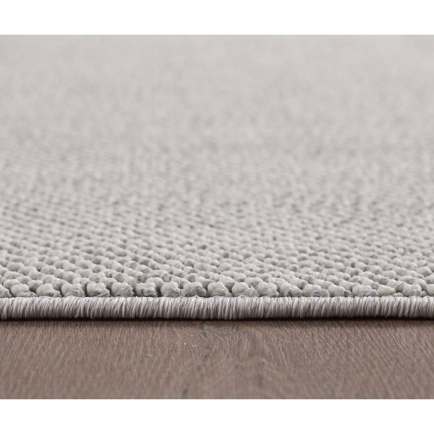 Detailansicht Ayyildiz Kurzflorteppich Loom 4300, silber, Ø 120 cm. Nahaufnahme der Teppichstruktur.