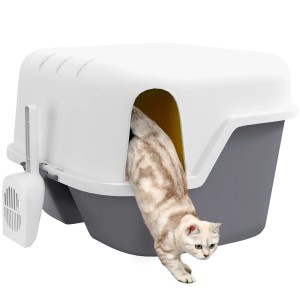 Cremeweiße PawHut Katzentoilette mit Katze beim Verlassen, inklusive Schaufel.