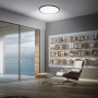 Schwarzes Brilo LED-Panel Slim Sternenhimmel, neutralweiß, Ø 37,5 cm, an der Decke montiert.