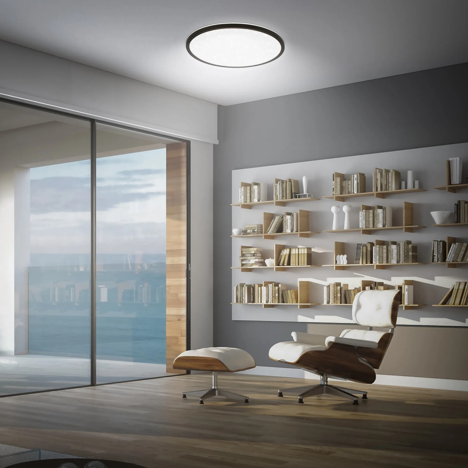 Schwarzes Brilo LED-Panel Slim Sternenhimmel, neutralweiß, Ø 37,5 cm, an der Decke montiert.