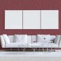 Grafische Vliestapete im Wohnzimmer mit weißem Sofa, Couchtischen und Bildern.