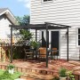 Dunkelgraue Furnicato Gartenpergola 3x3m mit verstellbarem Dach und Metallrahmen auf einer Holzterrasse.
