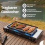 Evocamp Camping Gaskocher 2-flammig mit Grillaufsatz und Speisen auf einem Holztisch im Freien.