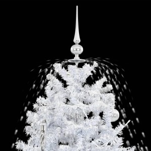 Schneiender, weißer Weihnachtsbaum (140 cm) mit silbernen Kugeln und Baumspitze. Schnee fällt.