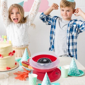 Rote HOMCOM Zuckerwattemaschine auf Partytisch mit Kindern im Hintergrund.