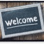Fußmatte Astra Deco Brush mit Welcome Schild, 50x70 cm, für den Eingangsbereich.