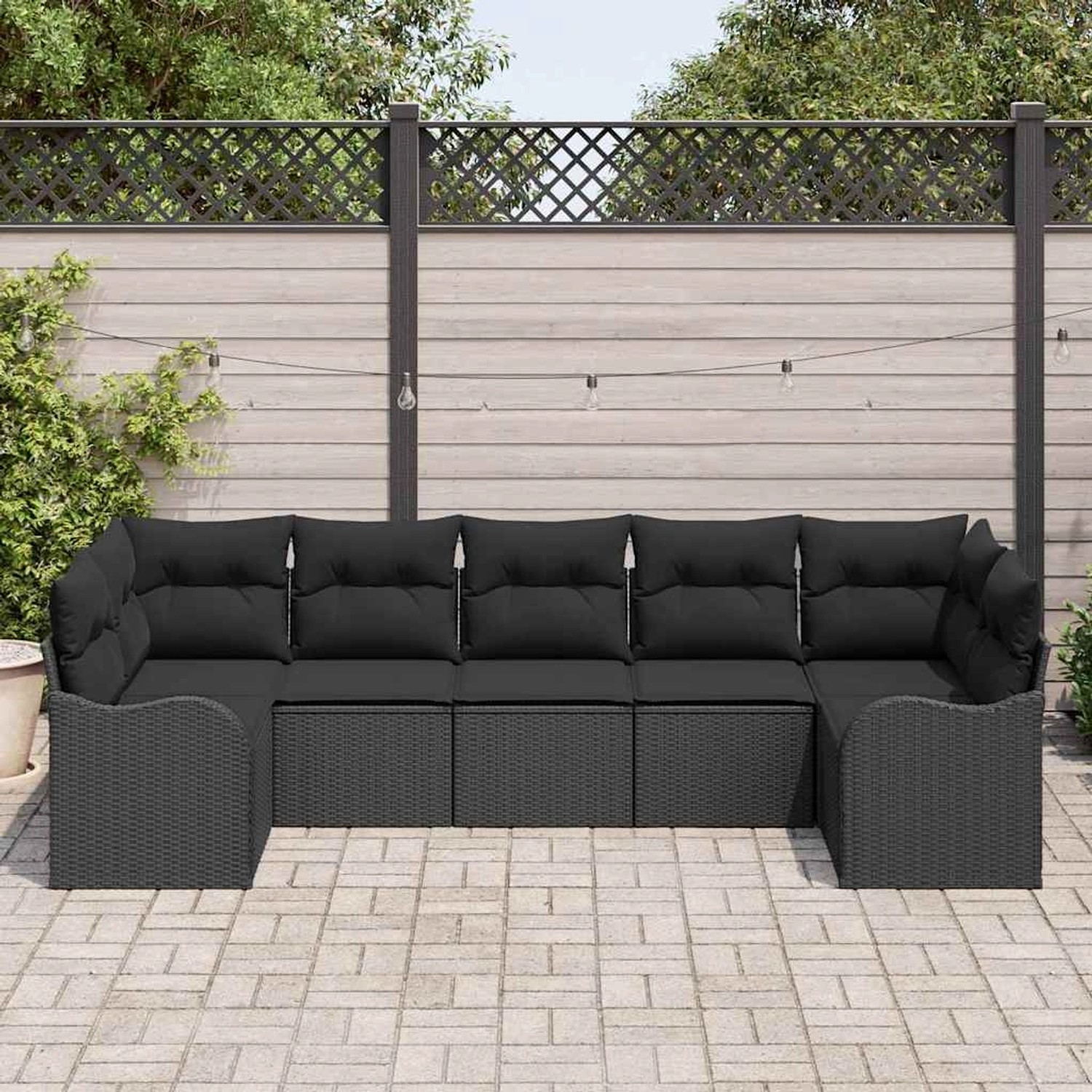 Schwarzes 7-teiliges vidaXL Garten-Sofa-Set aus Poly Rattan mit Kissen.