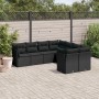 Schwarze 8-tlg. vidaXL Garten-Sofagarnitur aus Polyrattan mit Kissen auf einer Terrasse.