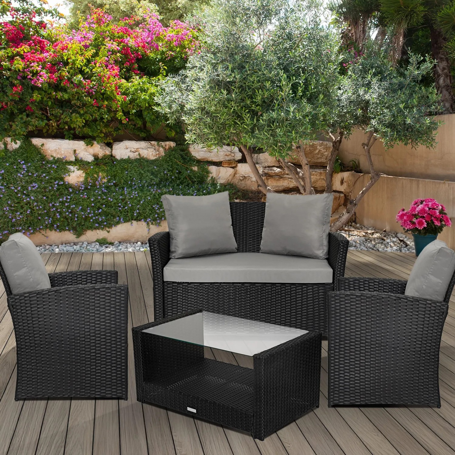 Schwarze Svita Roma Polyrattan Sitzgruppe mit Tisch und grauen Kissen für den Garten.