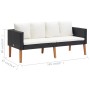 Schwarzes 2-tlg. Garten Lounge Set aus Rattan mit cremeweißen Kissen und Tisch.