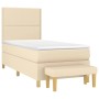Cremefarbenes Boxspringbett 100x200 cm mit Matratze und Bank, Stoffbezug.