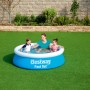 Blauer Bestway Fast Set Aufstellpool (Ø 183 cm) mit spielenden Kindern und Erwachsenen im Garten.