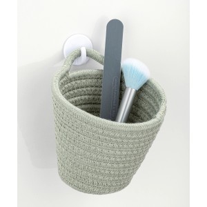 Wenko Aufbewahrungskorb Soria, lindgrün, mit Nagelfeile und Pinsel im Badezimmer.
