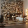 Wohnraum mit Fototapete Stone Wall von Komar, 368x254 cm, Steinwand-Optik.