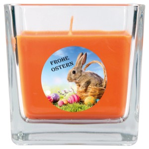 Orangefarbene Duftkerze im Glas mit Osterhase und Korb Motiv, Brenndauer 50h.