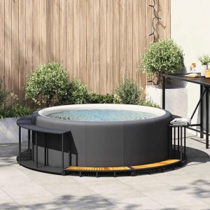 vidaXL Whirlpool mit schwarzer Poly Rattan Umrandung und Holztreppe.