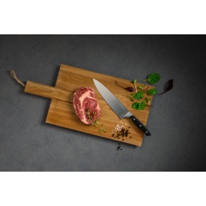 Nirosta Kochmesser Trinity, 34 cm, auf Holzbrett mit Steak, Kräutern und Gewürzen.