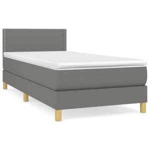 Dunkelgraues Boxspringbett 90x200 cm mit Matratze und Kopfteil. Bequemes Einzelbett für erholsamen Schlaf.